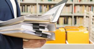 a man holding documents