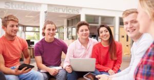 group of students sitting in college