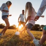 students playing football in ground