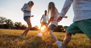 students playing football in ground