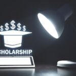 a lamp focuses on a scholarship word