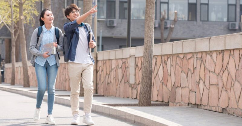 a girl and boy visiting college campus