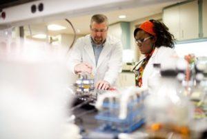 a science lap with students and a professor