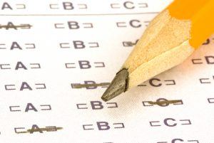 a pencil on a answer sheet