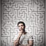 Photo of a man behind a maze