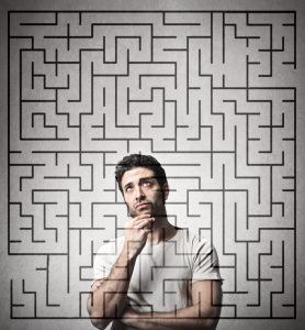 Photo of a man behind a maze