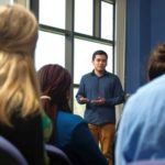 a teacher communicating with students in a classroom