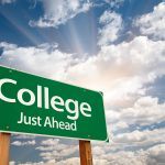 A street sign that says " College Just Ahead"