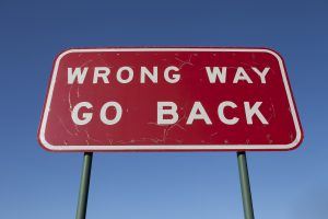 wrong way go back sign board