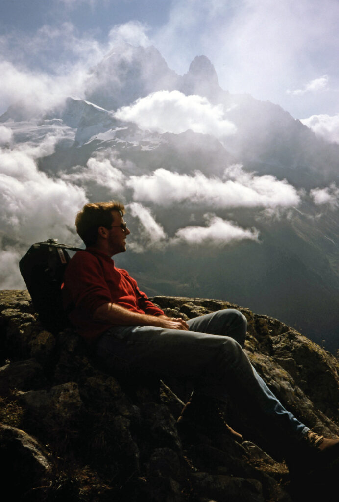 young man at base of Mont Blanc