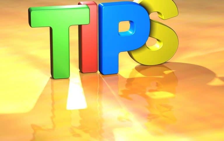 The word TIPS is written in large, colorful 3D letters (green, red, blue, and yellow) on a shiny, golden-yellow surface with shadows reflected below.