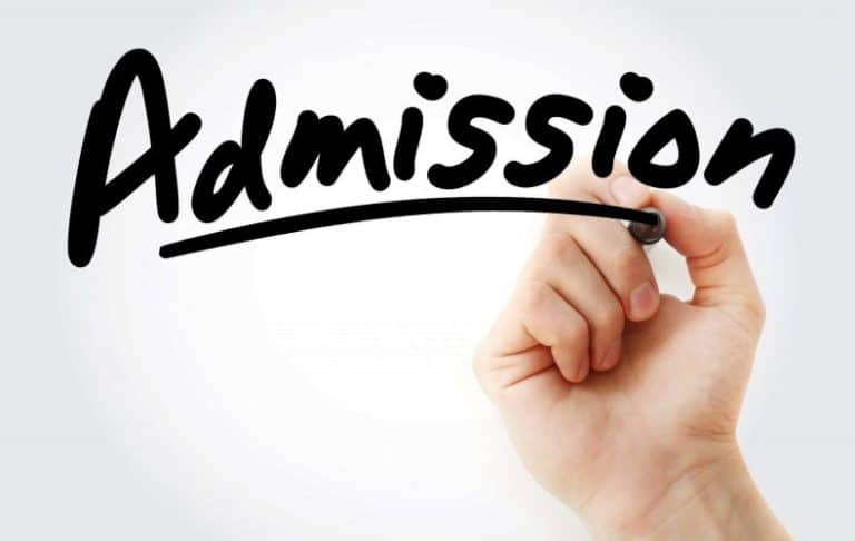 A hand writes the word Admission in large, black, cursive letters on a white background, with a line drawn underneath the word.