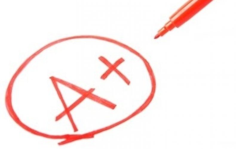 A+ grade written in red color with a pen