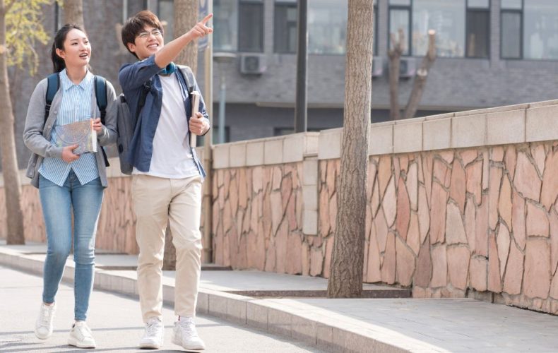 a girl and boy visiting college campus