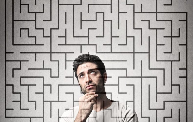 Photo of a man behind a maze