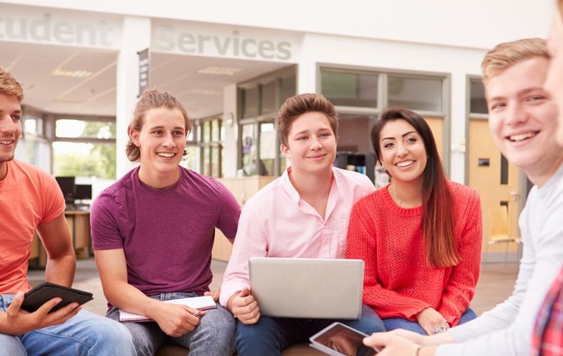 group of students sitting in college