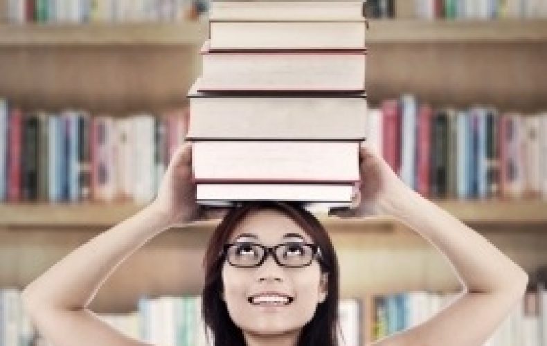 girl-with-many-books-in-library