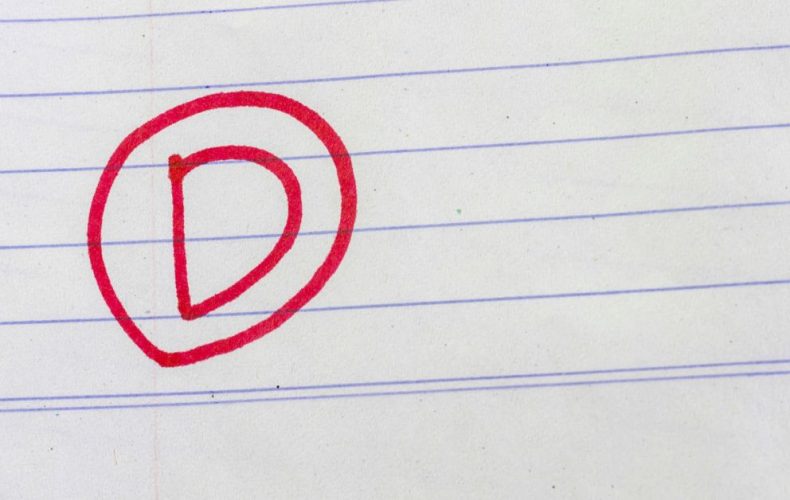 D grade written on paper