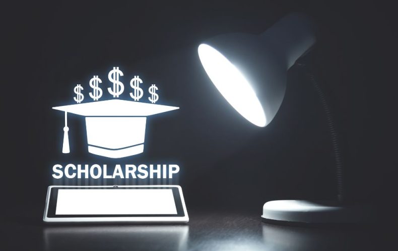 a lamp focuses on a scholarship word